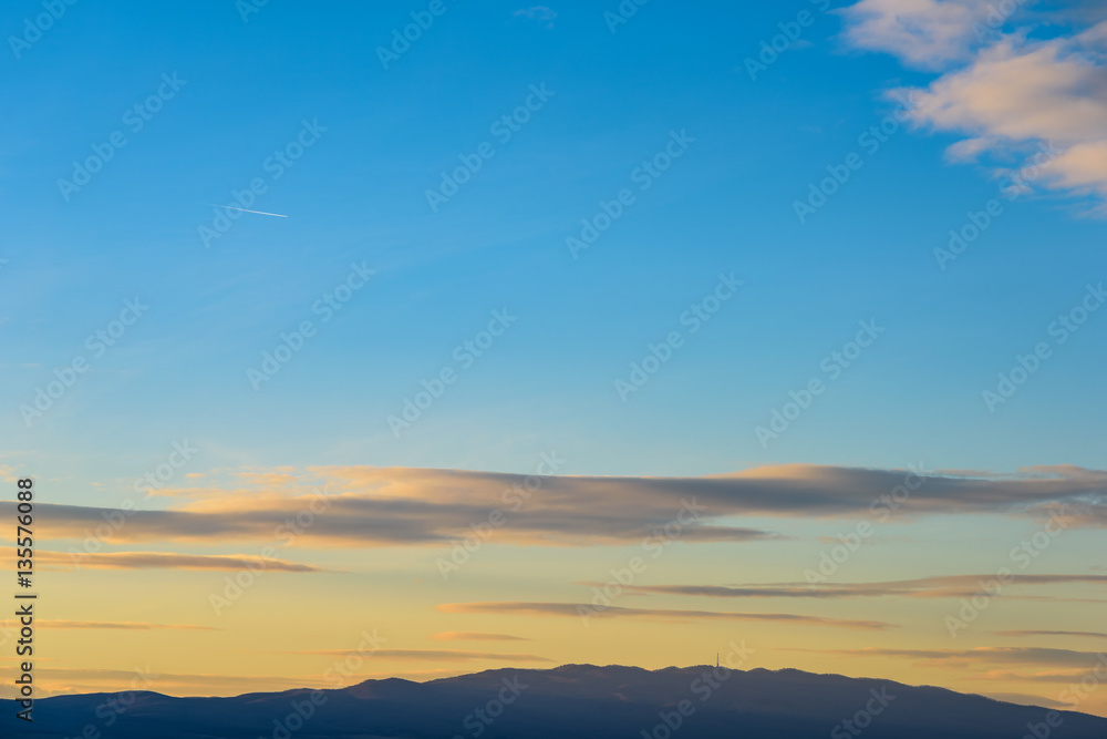 Fototapeta premium Beautiful Sunset Cloudy Sky Over Mountains