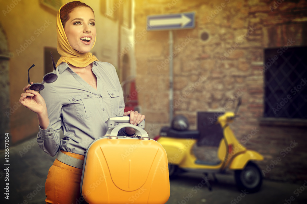 Italian vacation. Woman with suitcases on street. Italian vacation. Woman with suitcases on street.