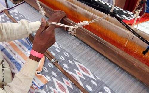 worker weaving hand loom Indian saree or sari,traditional woman dress