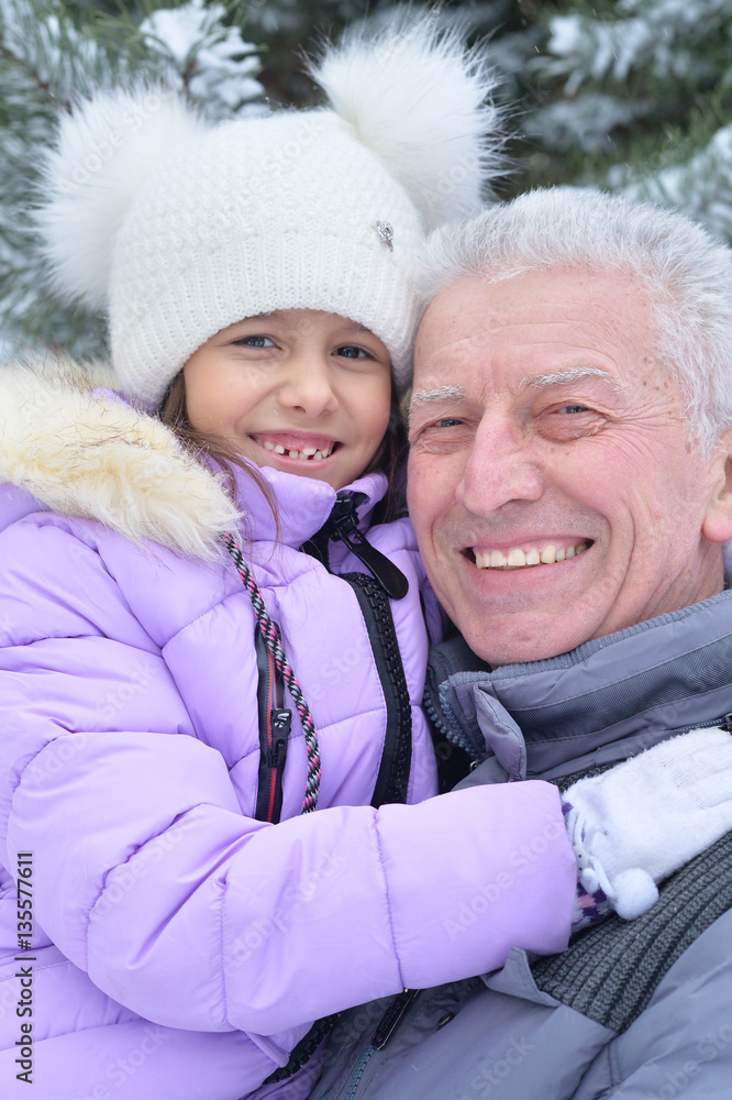 grandfather with granddaughter smiling