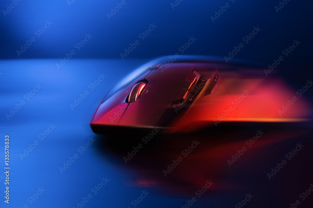High technology computer gaming mouse fast moving in blue tone High technology computer gaming mouse fast moving in blue tone
