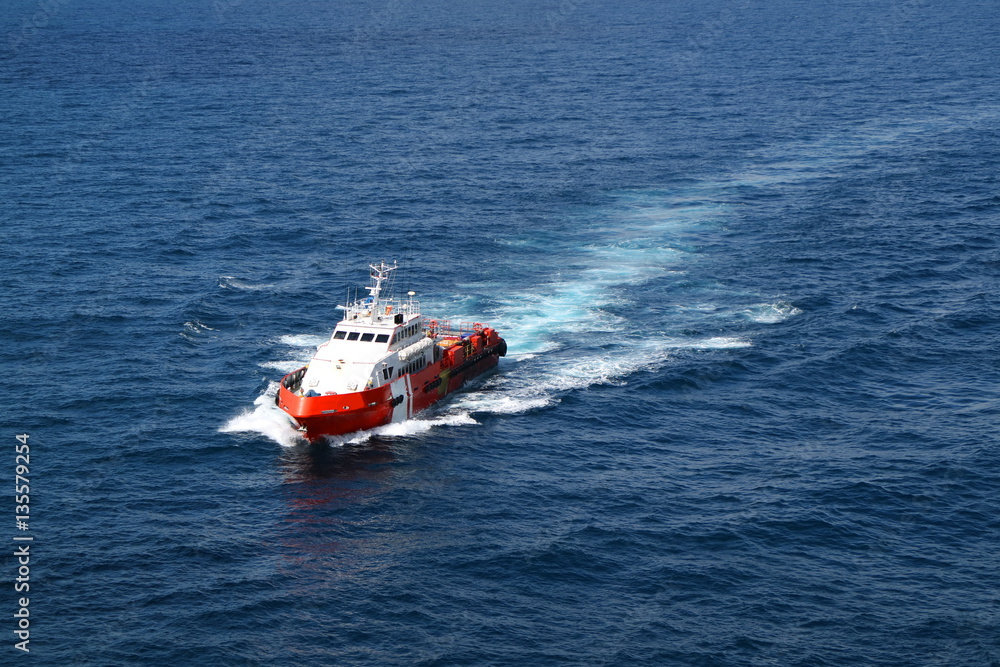 Naklejka premium Supply boat transfer cargo to oil and gas industry
