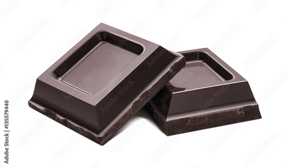 Small dark chocolate pieces isolated on white background Small dark chocolate pieces isolated on white background