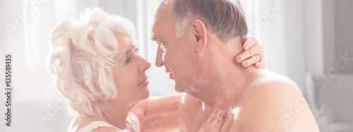 Foto Happy mature couple during intimate moment