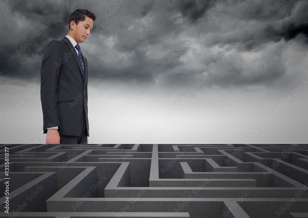 © vectorfusionart - Conceptual image of businessman looking over maze