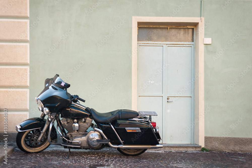 Chopper motorcycle near a wall