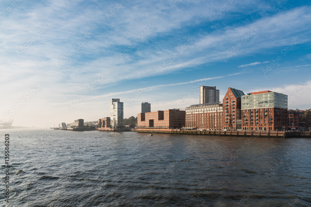 Hamburg, Germany - November 01, 2015: Scenic view from the river Elbe towards the open sea with fascinating fascades right hand Hamburg, Germany - November 01, 2015: Scenic view from the river Elbe towards the open sea with fascinating fascades right hand