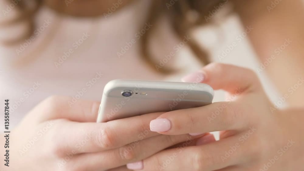 Close up of women hands using mobile phone indoors Close up of women hands using mobile phone indoors