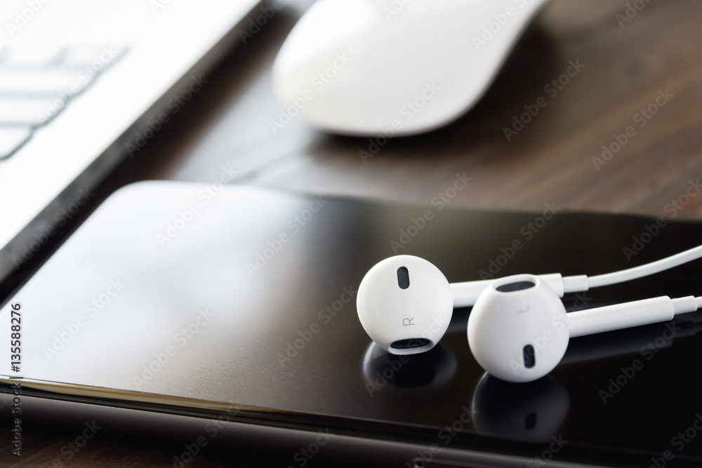 Close-up headphone stack on phone, accessories Close-up headphone stack on phone, accessories