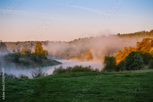 Morning fog over the river. Beautiful Landscape