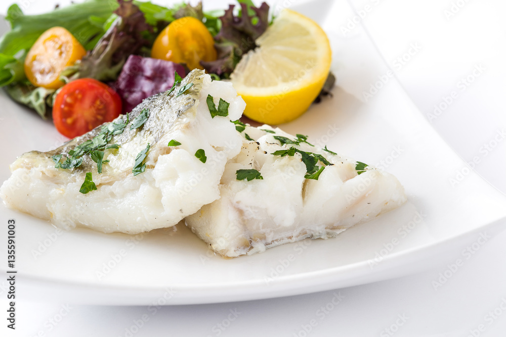 Fried cod fillet and salad in plate isolated on white background
Fried cod fillet and salad in plate isolated on white background