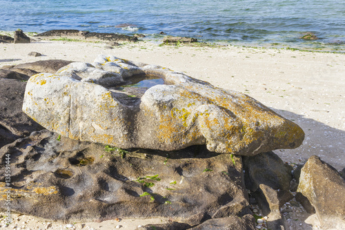 Gnamma holes on granite rock photo