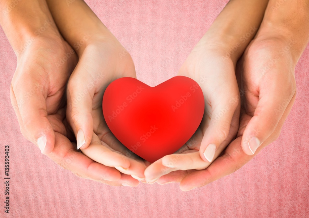 Hands of couple holding a heart Hands of couple holding a heart