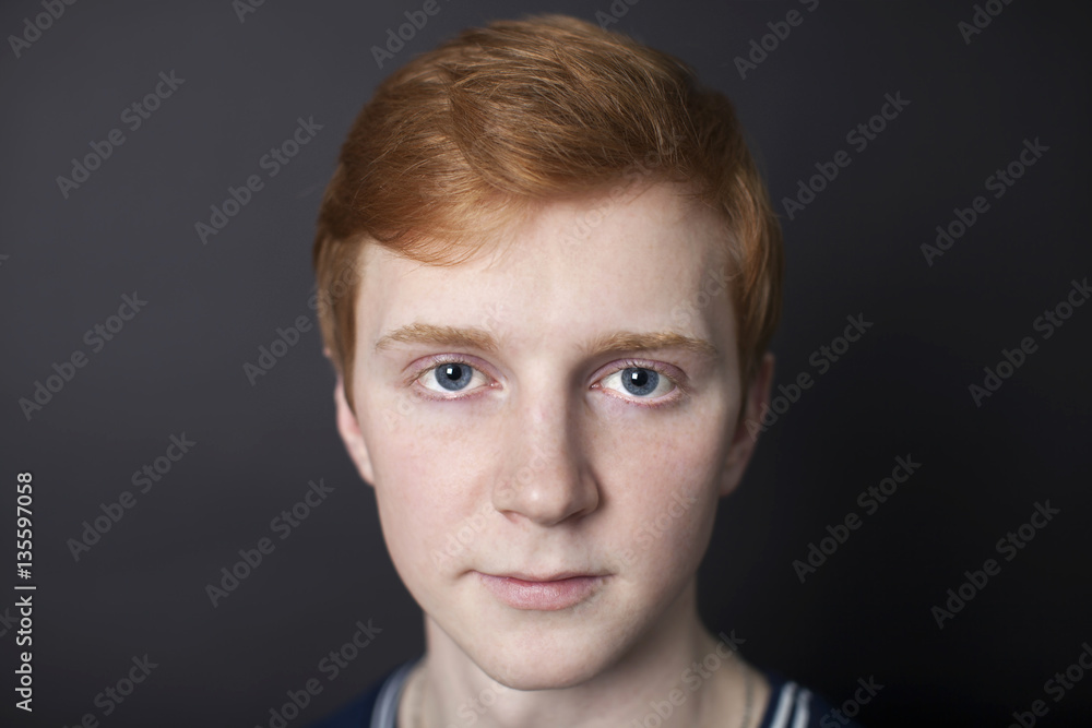 Portrait of red-haired handsome guy