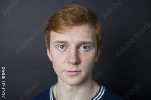 Portrait of red-haired handsome guy