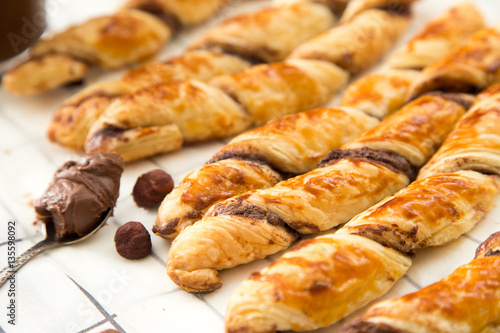 homemade cakes - puff pastry with chocolate paste. twisted cakes
