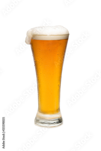 Beer In a Pilsner Glass with foam Top