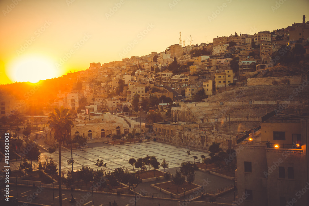Cityscape Amman downtown at dawn. Capital of Jordan. Tourism concept. Arab city. Toned. Roman theater Amman symbol. This city was initially built on seven hills. Old Town