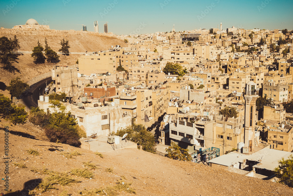 Amman city view with Umayyad Palace on background. Urban landscape. Residential area. Arabic architecture. Eastern city