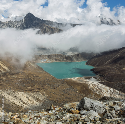 The view from the Renjo Pass (5360 m) on the Dudh Pokhari lake and the village of Gokyo - Nepal, Himalayas photo