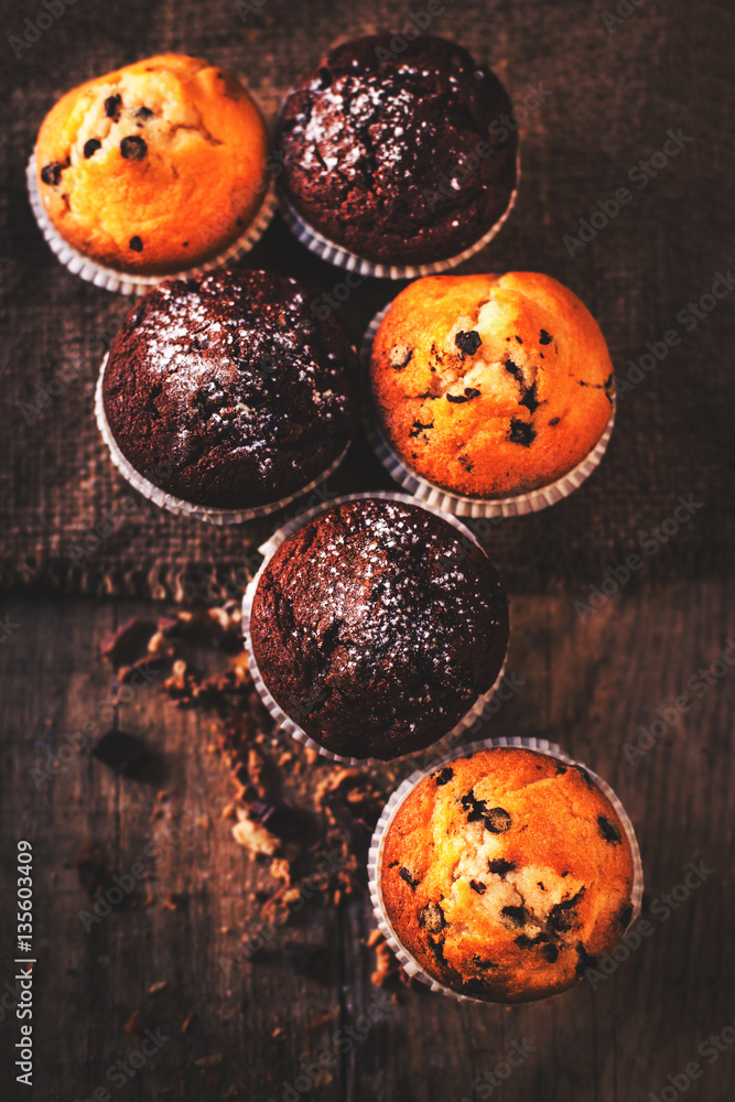 .Chocolate muffins on wooden table, homemade bakery, close up i .Chocolate muffins on wooden table, homemade bakery, close up i