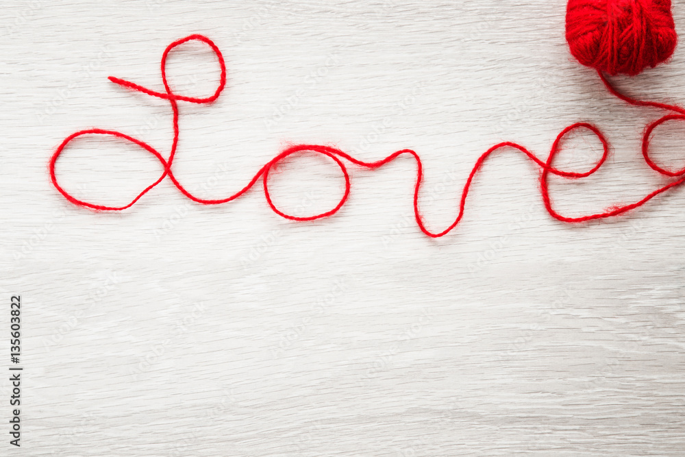 Word love created from red yarn.  Valentines Day.