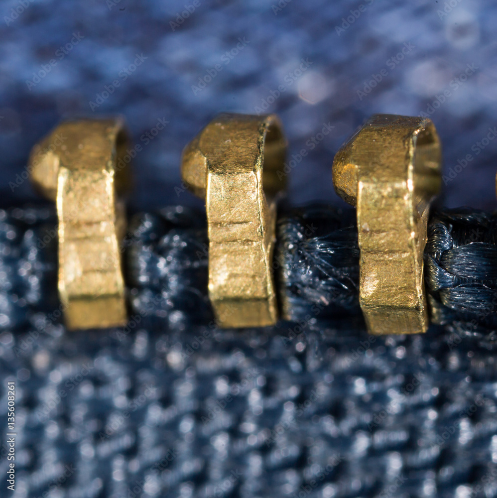 zipper on jeans as a background. macro zipper on jeans as a background. macro