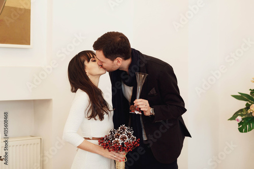 beautiful young bride and groom kiss each other on wedding cerem photo