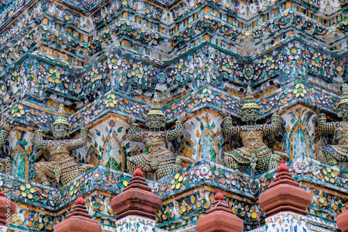 Demon Guardian Statues at pagoda of Temple of Dawn, Wat Arun, Bangkok, Thailand. Magnificent Architecture of Wat Arun