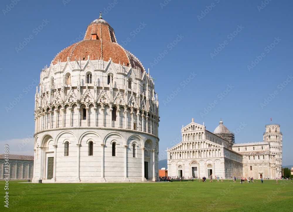 The Battistero, cathedral and leaning tower of  the Piazza dei Miracoli in Pisa, Italy.
