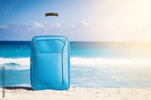 Travel trolley on tropical seaside