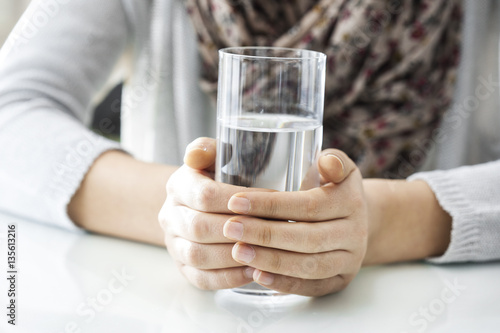 Young woman drinking water