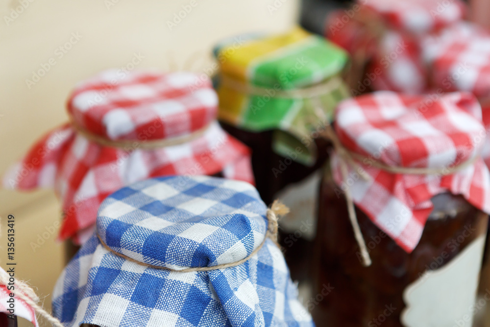 Homemade jams in glass jars for sale on country fair
