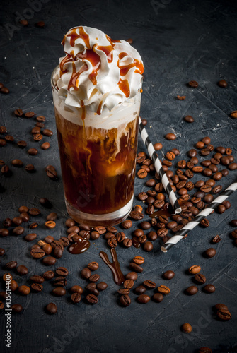 Fotografija Cold coffee drink frappe (frappuccino), with whipped cream and caramel syrup, wi