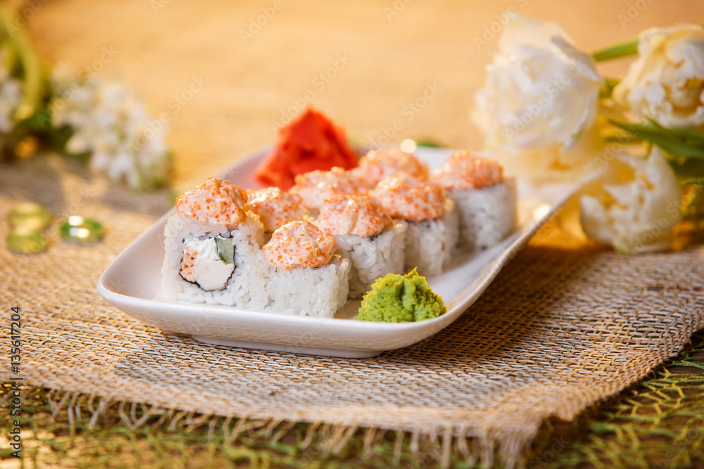 Traditional sushi rolls made of rice with caviar and sauce