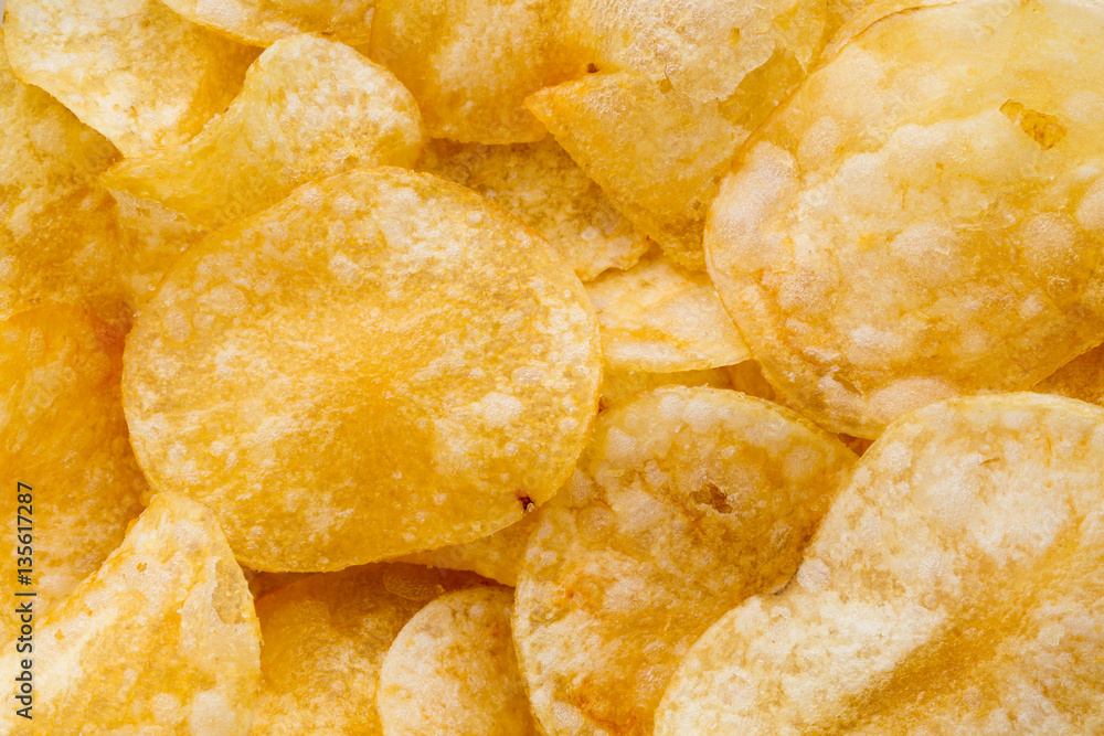 Close up potato chips on wood top view background. Close up potato chips on wood top view background.
