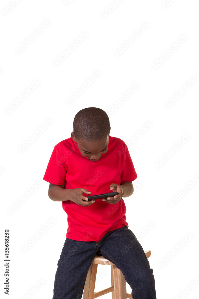 School aged boy with a cell phone