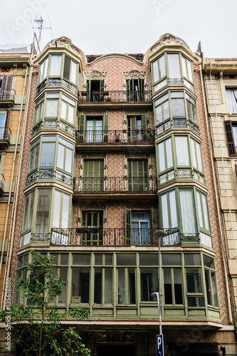 Building facade: Old style windows, balcony. Barcelona. Spain.