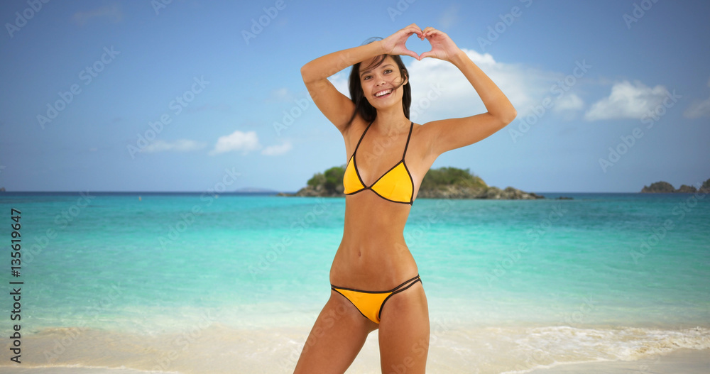 Young white girl jumps playfully on a Caribbean beach Young white girl jumps playfully on a Caribbean beach