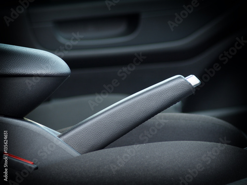 interior modern car elements, close-up of handbrake and seat belt
