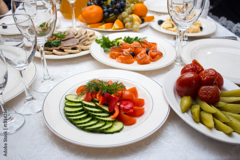 Shot of salads and vegetables served tables ready for celebration Shot of salads and vegetables served tables ready for celebration