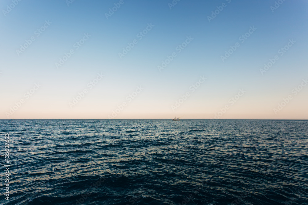 Fototapeta premium Blue calm sea. Summer landscape with sea and horizon over water