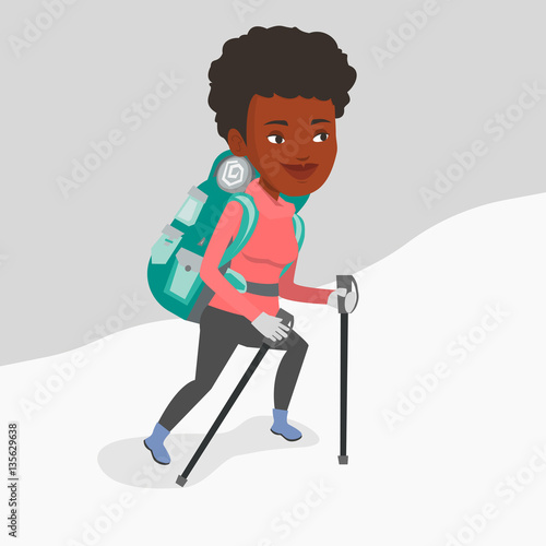 Young mountaneer climbing a snowy ridge.