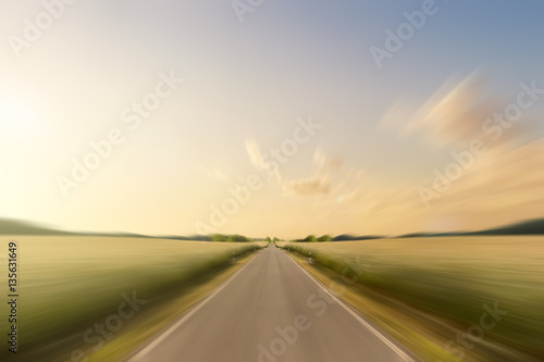 empty, straight road in rural landscape © hanohiki