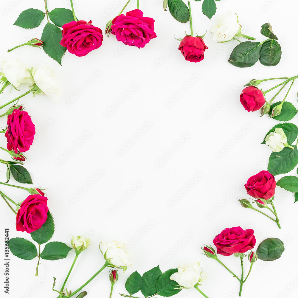 Round frame with red and white roses and leaves isolated on white background. Flat lay, top view