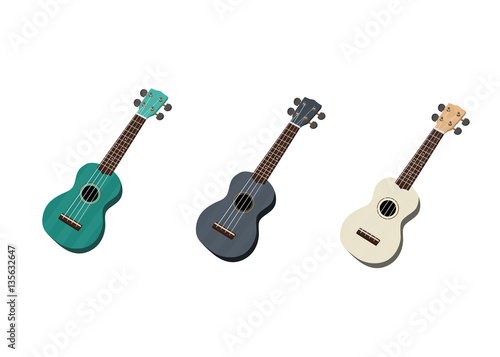 Tres ukuleles de colores, azul, celeste y blanco en fondo aislado