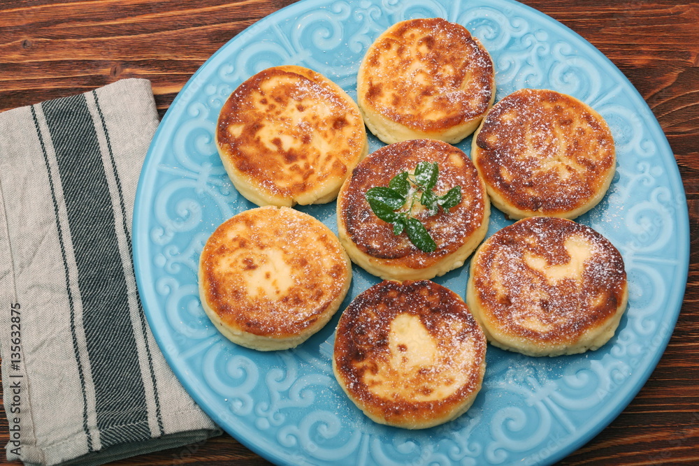 Cheese pancakes fried in a pan. Cheese pancakes fried in a pan.
