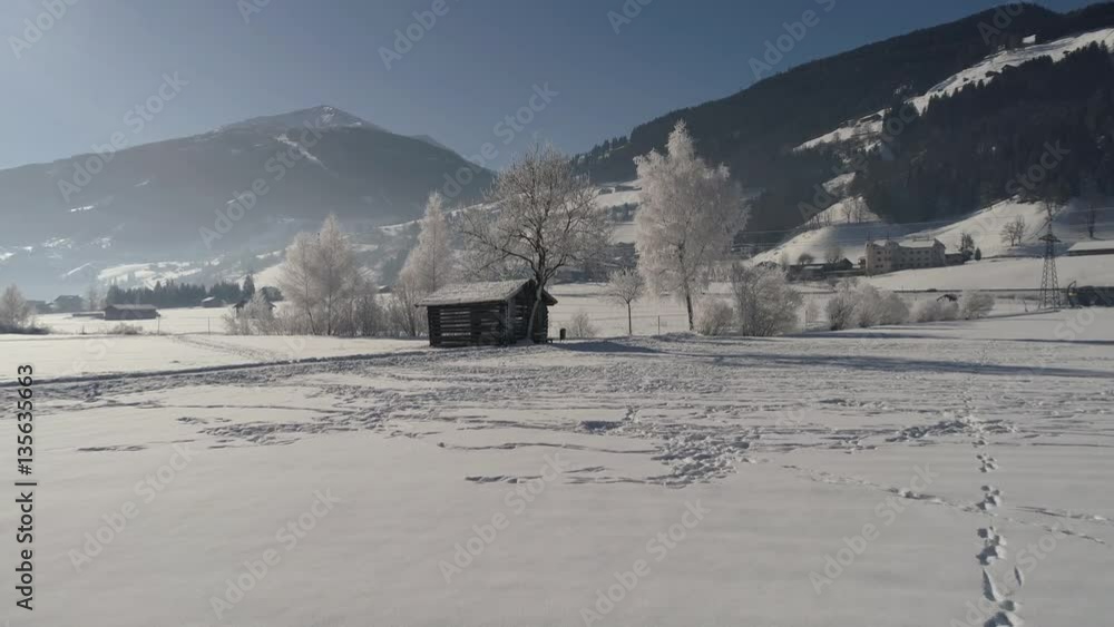 Barn in the snow-covered field. Flying on drone Barn in the snow-covered field. Flying on drone