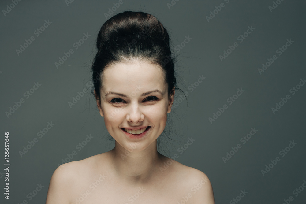 happy woman with a bunch of hairs on her head fashionable hairdress... happy woman with a bunch of hairs on her head fashionable hairdress...