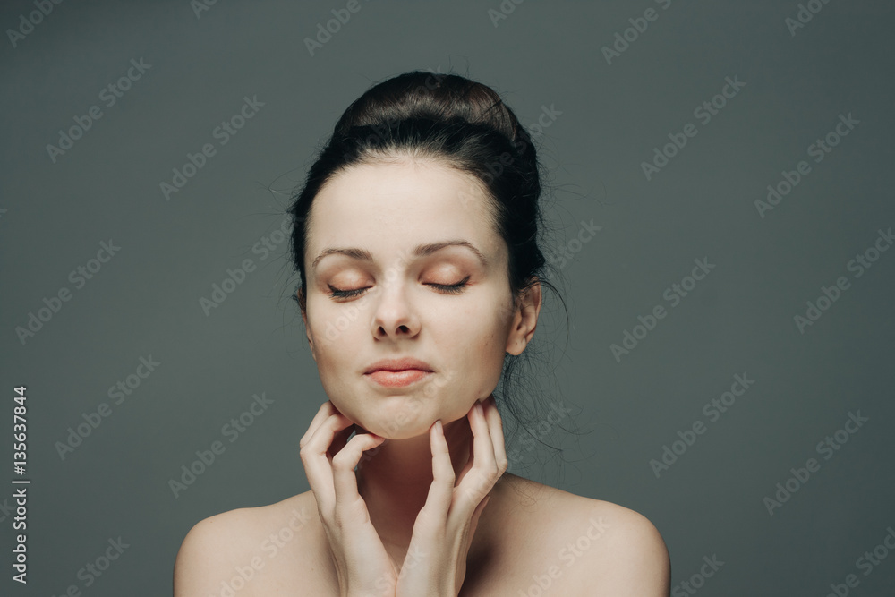 gray background and beautiful woman with closed eyes gray background and beautiful woman with closed eyes